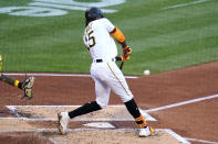 Pittsburgh Pirates' Oneil Cruz hits a two-run home run off Milwaukee Brewers starting pitcher Adrian Houser during the second inning of a baseball game in Pittsburgh, Thursday, June 30, 2022. (AP Photo/Gene J. Puskar)