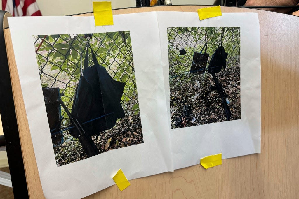 Photos that show an AK-47 rifle, a backpack and a Go-Pro camera on a fence outside Trump International Golf Club