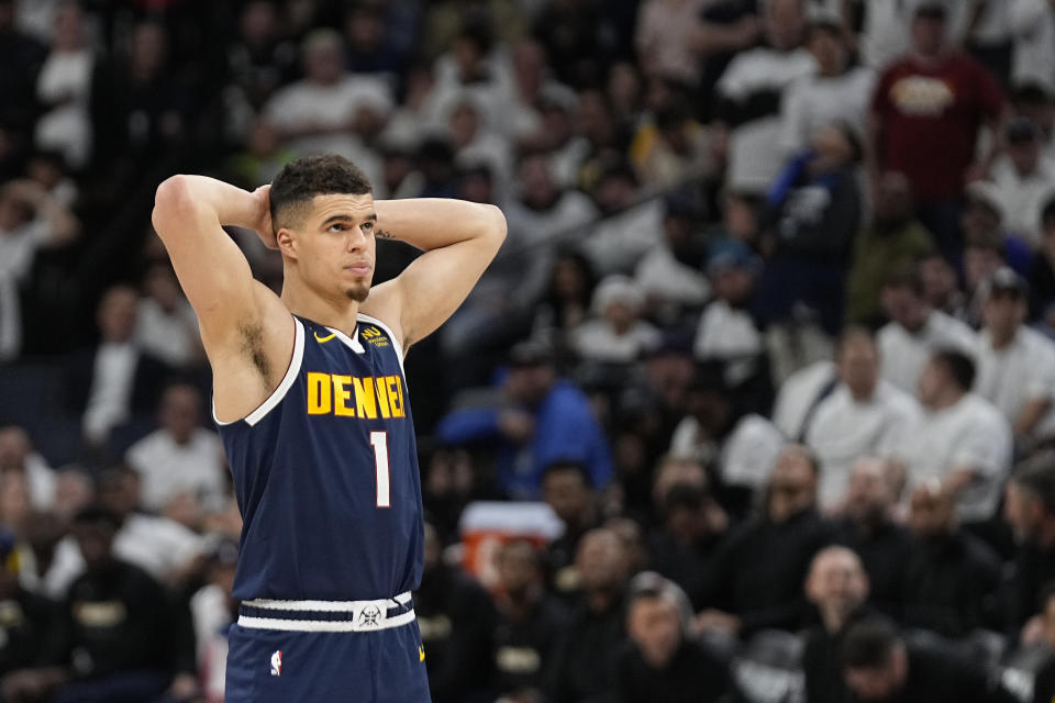 Denver Nuggets forward Michael Porter Jr. (1) looks at the video board during the second half of Game 4 of an NBA basketball first-round playoff series against the Minnesota Timberwolves, Sunday, April 23, 2023, in Minneapolis. (AP Photo/Abbie Parr)