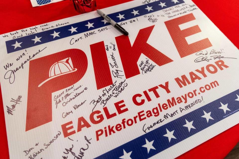 Attendees of an election night watch party for Brad Pike signed a campaign sign.