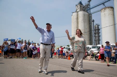 FILE PHOTO: Democratic presidential hopeful Sen. Bernie Sanders and his wife Jane Sanders wave as they march during the Independence Day Parade in Waukee, Iowa