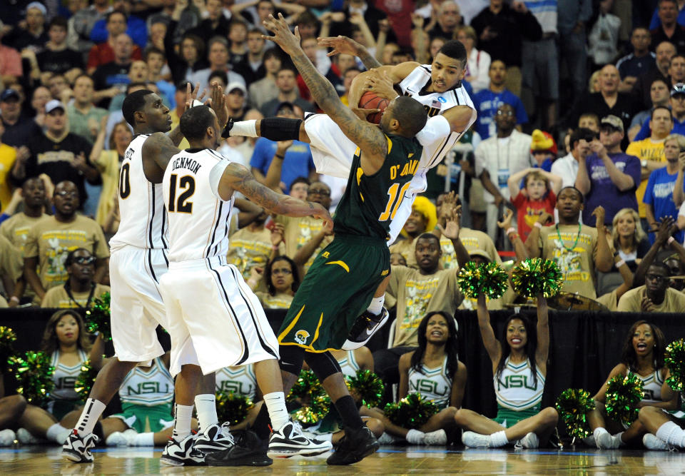 OMAHA, NE - MARCH 16: Phil Pressey #1 of the Missouri Tigers attempts to take the ball from Kyle O'Quinn #10 of the Norfolk State Spartans in the final minutes of the game during the second round of the 2012 NCAA Men's Basketball Tournament at CenturyLink Center on March 16, 2012 in Omaha, Nebraska. (Photo by Eric Francis/Getty Images)