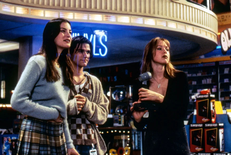 The cast of Empire Records including Liv Tyler and Renee Zellweger in a scene from the movie