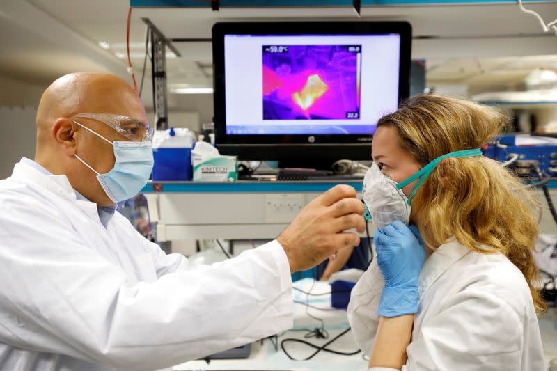 Israeli Professor Yair Ein-Eli, who led the research team which say they have invented a reusable face mask that can disinfect itself and kill the coronavirus disease (COVID-19), takes part in a demonstration for Reuters in Haifa, northern Israel