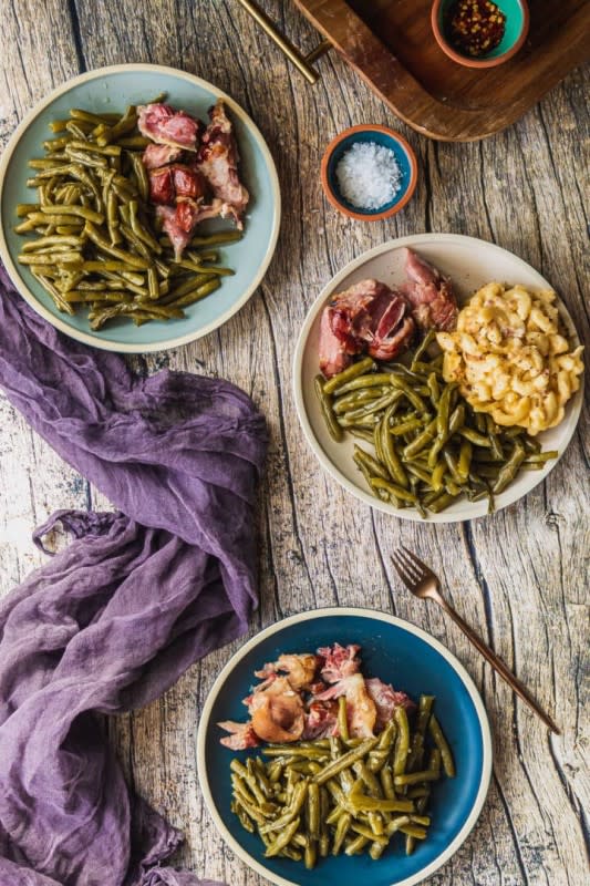 <p>Sweet Tea and Thyme</p><p>These flavorful and tender green beans have been a Southern staple for generations. Slow-cooked in a vitamin-rich broth with smoked meat, this cultural side dish is on every Southern holiday table!</p><p><strong>Get the Recipe:</strong> <strong><a href="https://www.sweetteaandthyme.com/easiest-slow-cooked-southern-green-beans/" rel="nofollow noopener" target="_blank" data-ylk="slk:Authentic Southern Green Beans;elm:context_link;itc:0;sec:content-canvas" class="link ">Authentic Southern Green Beans</a></strong></p>