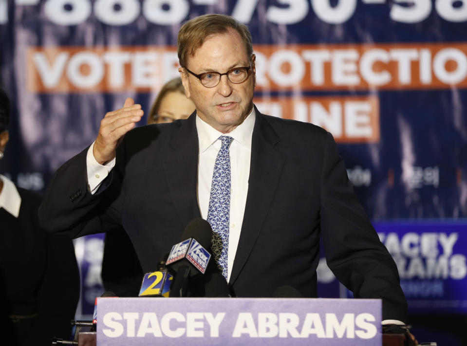 John Chandler, one of Stacey Abrams' attorneys, speaks during a news conference Thursday, Nov. 8, 2018, in Atlanta. Republican Brian Kemp resigned Thursday as Georgia's secretary of state, a day after his campaign said he's captured enough votes to become governor despite his rival's refusal to concede. Abrams' campaign immediately responded by refusing to accept Kemp's declaration of victory in the race and demanding that state officials "count every single vote." (Bob Andres/Atlanta Journal-Constitution via AP)