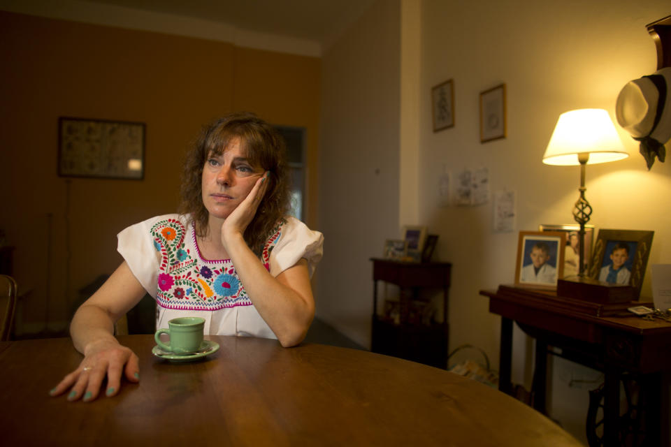 In this April 8, 2014 photo, Maria Eugenia Diez pauses during an interview in her home in Buenos Aires, Argentina. On Thursday, April 10, 2014, a nationwide strike paralyzed Argentina’s public transportation, all non-emergency hospital attention and other sections of public life. Diez, a middle-class housewife, says she's sympathetic to the union workers' salary woes and supports many of the government's efforts to direct resources to the poor, but thinks the strike just takes more money from everyone's pockets. (AP Photo/Victor R. Caivano)