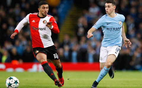 Phil Foden (right) in action for City - Credit: PA