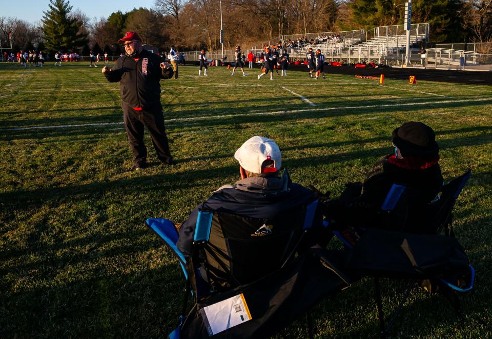 Jacksonville head football coach Mark Grounds thanks fans as the Crimsons get set to take on Rochester at Rocket Booster Stadium at Rochester High School in Rochester, Ill., Friday, March 19, 2021.