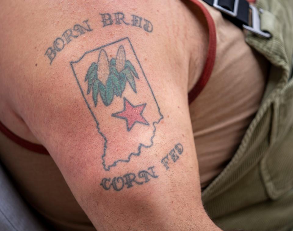 A tattoo on the arm of Revered Peyton with The Reverend Peyton’s Big Damn Band, at home in rural Brown County, Ind., Thursday, Oct. 26, 2023. A few weeks ago, the couple got into an altercation with a motorist in Aurora, Colo., that resulted in injuries to Breezy.