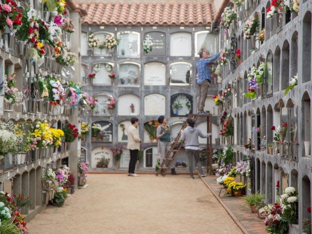 Cemetery decorated with flowers for the family of the deceased people on the Day of the Dead (Tots Sants) a catholic tradition. Catalonia Europe.