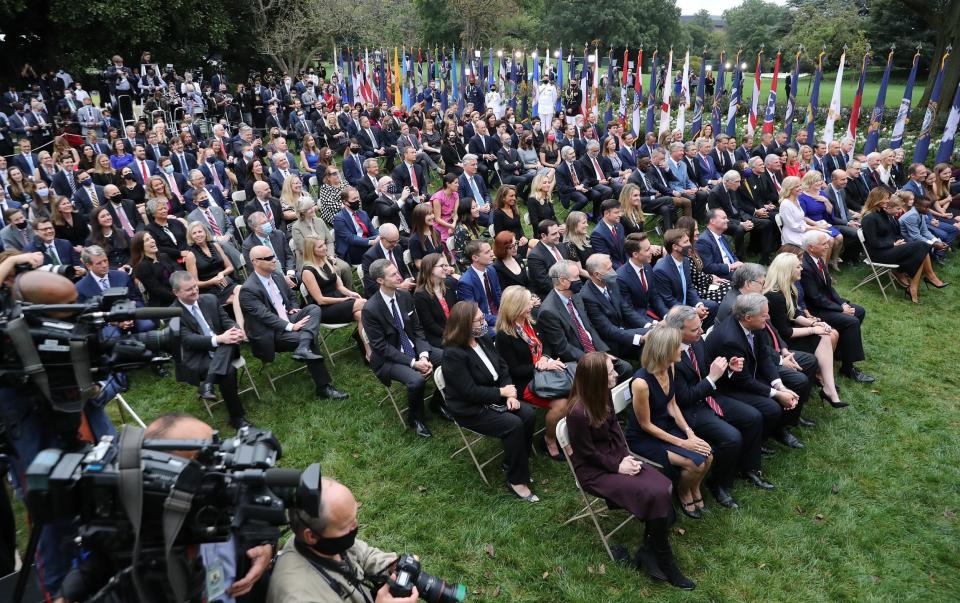 Guests watch as US President Trump introduces Amy Coney Barrett as his nominee to the Supreme Court in the Rose Garden at the White House while Covid goes about its hidden business - Getty Images