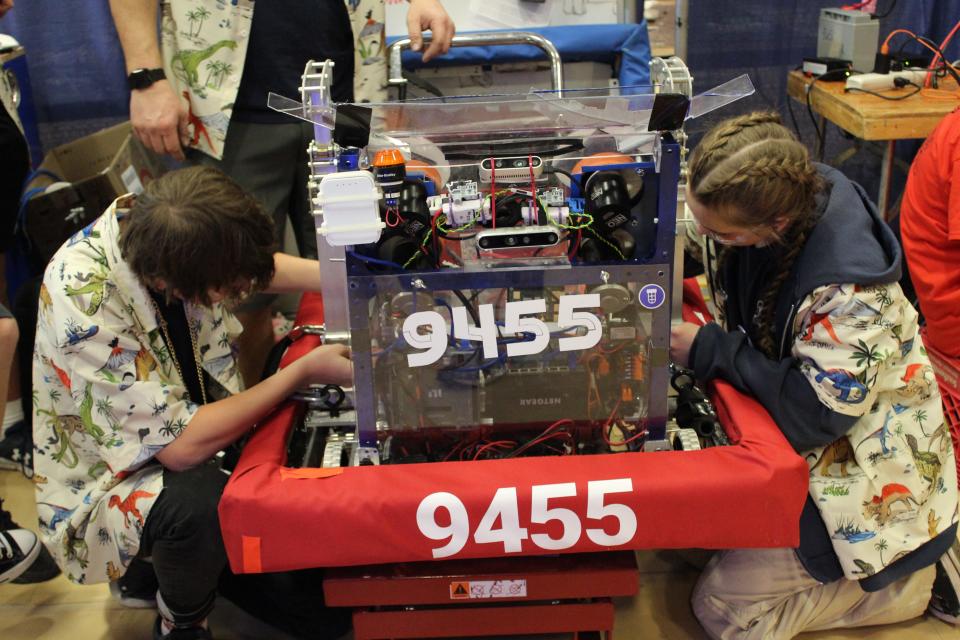 Livingston County will be represented by a high school team from the STEAM Syndicate at the FRC World Championships this week in Houston. Nick Ray and Elizabeth Arrowood working on Team 9455's robot in the pits at Troy District Event #2.