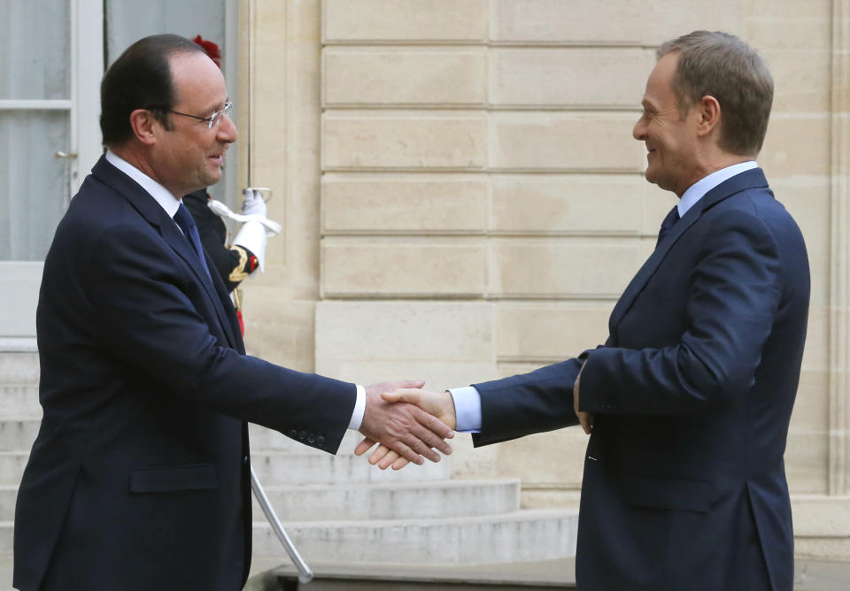 French President Francois Hollande, left, shakes hands with Polish Prime Minister Donald Tusk prior to meeting at the Elysee palace in Paris, Thursday, April 24, 2014 (AP Photo/Jacques Brinon)