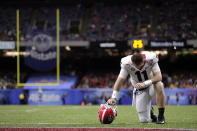 Georgia quarterback Jake Fromm (11) kneels down on the field before the Sugar Bowl NCAA college football game against Baylor in New Orleans, Wednesday, Jan. 1, 2020. (AP Photo/Brett Duke)