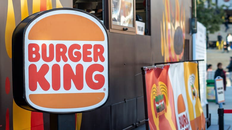 Burger King sign next to drive-thru window
