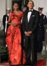 <b>State dinner, January 2011</b><br><br>Michelle Obama looked stunning in a floor length China Red Alexander McQueen gown.