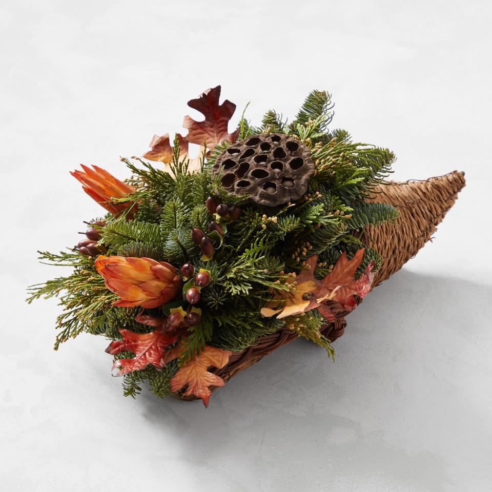 <p><a href="https://go.redirectingat.com?id=74968X1596630&url=https%3A%2F%2Fwww.williams-sonoma.com%2Fproducts%2Fthanksgiving-botanical-cornucopia%2F%3F_br_psugg_q%3Dcornucopia&sref=https%3A%2F%2F" rel="nofollow noopener" target="_blank" data-ylk="slk:Shop Now;elm:context_link;itc:0;sec:content-canvas" class="link ">Shop Now</a></p><p>Thanksgiving Botanical Cornucopia </p><p>$79.95</p><span class="copyright">Williams Sonoma</span>