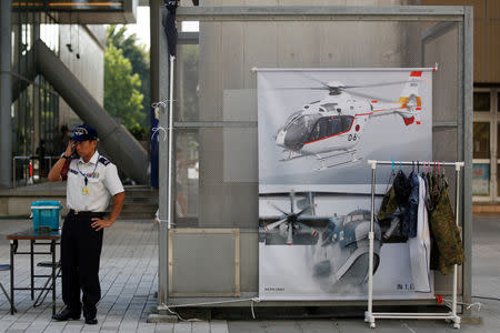 Japanese Ground Self-Defense Force's recruiter stands in front of a promotional booth during a public relations event to attract recruits in Tachikawa, western Tokyo, Japan August 26, 2018. REUTERS/Kim Kyung-Hoon