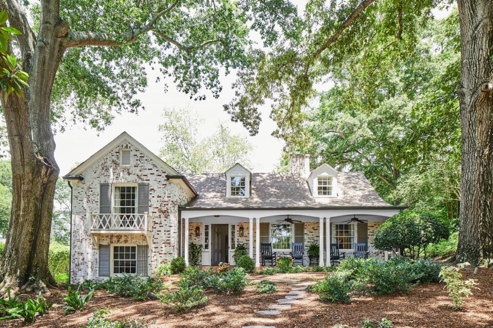 Split-level brick home with limewash treatment