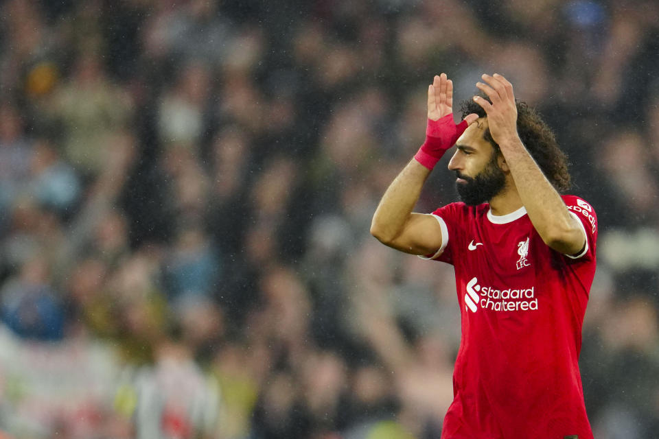 Liverpool's Mohamed Salah celebrates at the end of the English Premier League soccer match between Liverpool and Newcastle, at Anfield stadium in Liverpool, England, Monday, Jan. 1, 2024. (AP Photo/Jon Super)