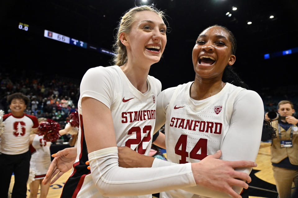 Stanford forward Cameron Brink (22) and forward Kiki Iriafen (44) celebrate after defeating Oregon State in an NCAA college basketball game in the semifinal round of the Pac-12 tournament Friday, March 8, 2024, in Las Vegas. (AP Photo/David Becker)