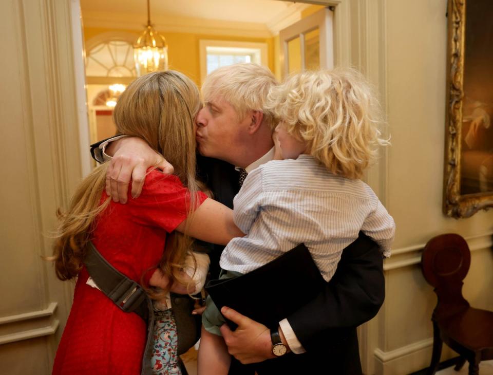 The Prime Minister Boris Johnson is comforted by his wife Carrie and their children after delivering his statement in Downing Street resigning as the leader of the Conservative Party (Andrew Parsons / No10 Downing Street)