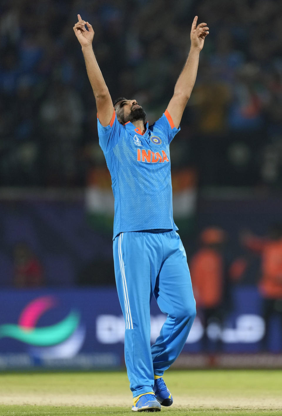 India's Mohammed Shami celebrates the wicket of New Zealand's Daryl Mitchell during the ICC Men's Cricket World Cup match between India and New Zealand in Dharamshala, India, Sunday, Oct. 22, 2023. (AP Photo/Ashwini Bhatia)