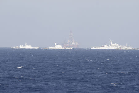 Chinese oil rig Haiyang Shi You 981 (C) is seen in the South China Sea, off the shore of Vietnam in this May 14, 2014 file photo. REUTERS/Minh Nguyen/Files