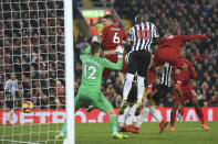 Liverpool's Fabinho, right, scores his side's fourth goal during the English Premier League soccer match between Liverpool and Newcastle at Anfield Stadium, Liverpool, England, Wednesday, Dec. 26, 2018. (AP Photo/Jon Super)