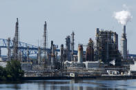 The Philadelphia Energy Solutions Refining Complex in Philadelphia is shown Wednesday, June 26, 2019. The owner of the largest oil refinery complex on the East Coast is telling officials that it will close the facility after a fire last week set off explosions and damaged the facility. Philadelphia Mayor Jim Kenney said in a Wednesday, June 26, statement that Philadelphia Energy Solutions has informed him of its decision.. (AP Photo/Matt Rourke)