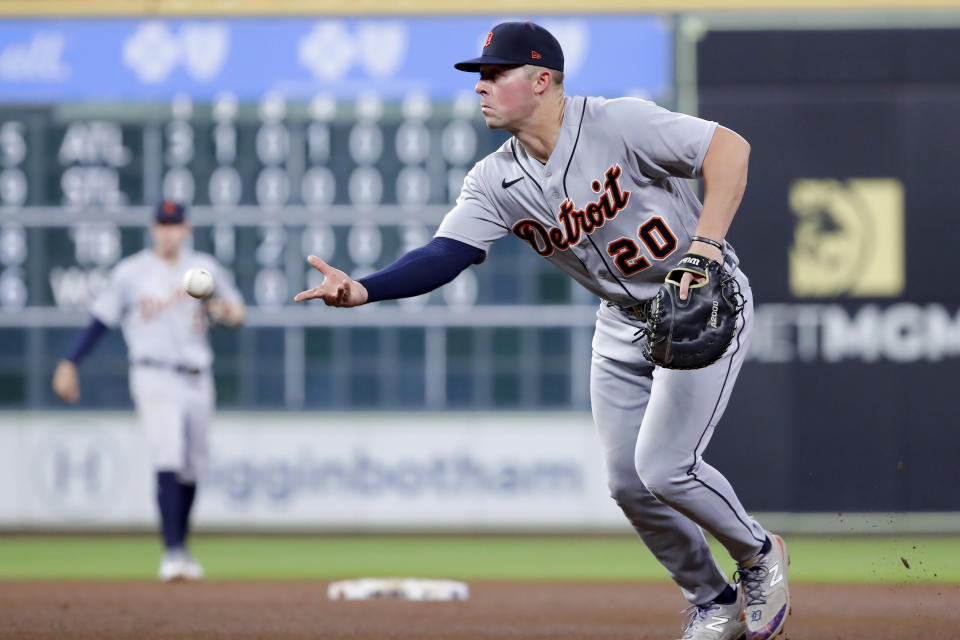 Detroit Tigers first baseman Spencer Torkelson (20) flips the ball to pitcher Eduardo Rodriguez for the out at first base on an infield grounder by Houston Astros' Jeremy Pena during the fifth inning of a baseball game Wednesday, April 5, 2023, in Houston. (AP Photo/Michael Wyke)