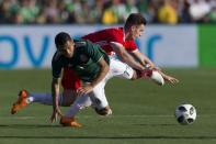 May 28, 2018; Los Angeles , Los Angeles, CA, USA; Mexico forward Jesus Manuel Corona (17) and Wales midfielder Tom Lawrence (11) battle for the ball during the first half at the Rose Bowl. Kelvin Kuo-USA TODAY Sports