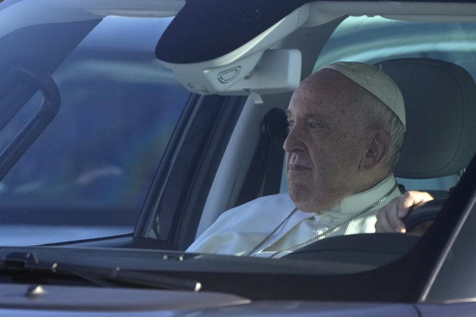 Pope Francis arrives to board his flight to Budapest at Rome's international airport in Fiumicino, Italy, Friday, April 28, 2023. The Pope is on his way to a three-day pastoral visit to Hungary. (AP Photo/Gregorio Borgia)