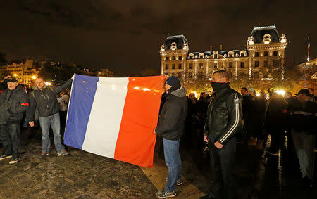 Police officers gather during an unauthorised protest against anti-police violence in front of the Police Prefecture in Paris, France, October 21, 2016. REUTERS/Jacky Naegelen