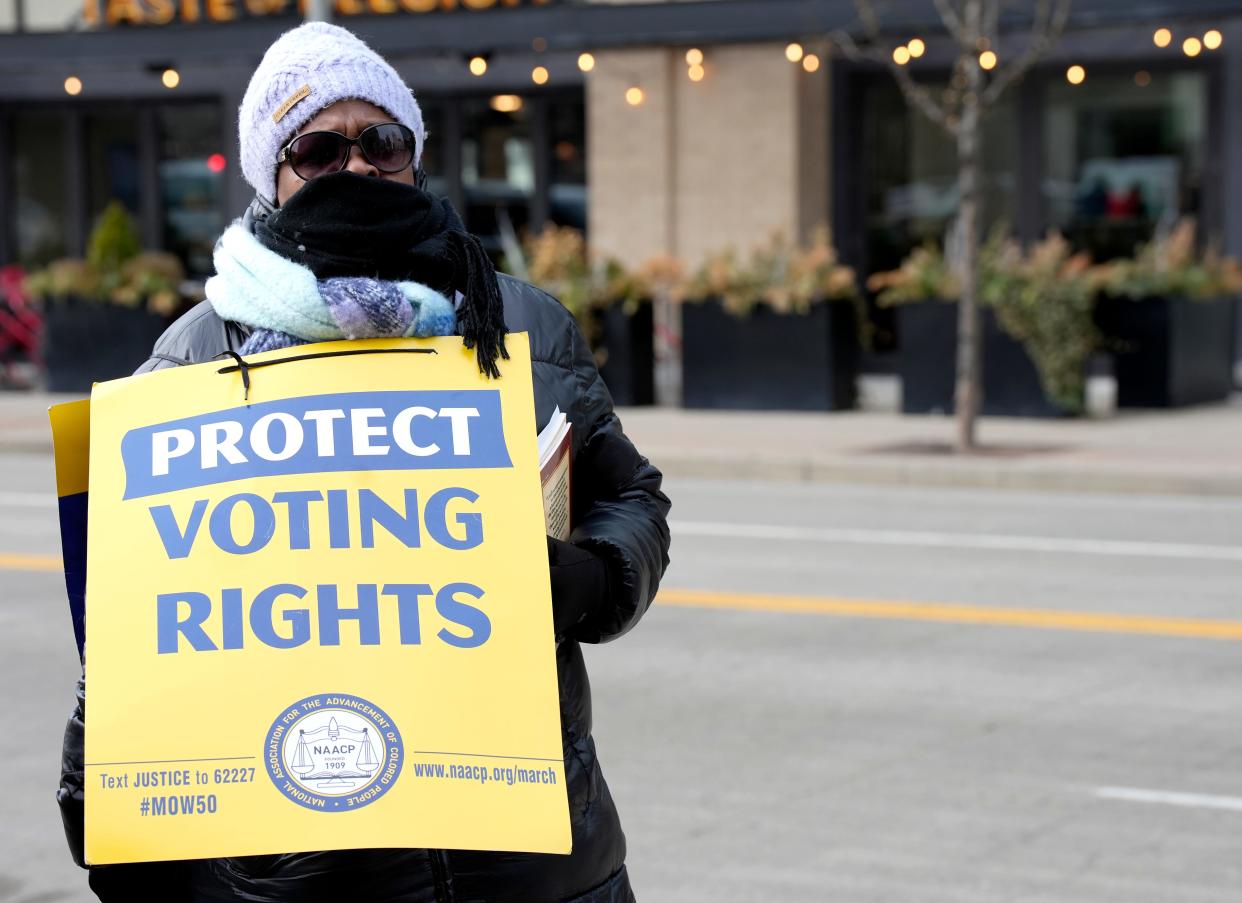 Linda Gamble of College Hill waits for the prayer service and march to begin to celebrate Rev. Martin Luther King, Jr. Monday, January 16, 2023 outside The National Underground Railroad Freedom Center.