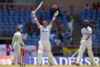 West Indies' Joshua Da Silva celebrates after he scored a century against England during day three of their third Test cricket match at the National Cricket Stadium in St. George, Grenada, Saturday, March 26, 2022. (AP Photo/Ricardo Mazalan)