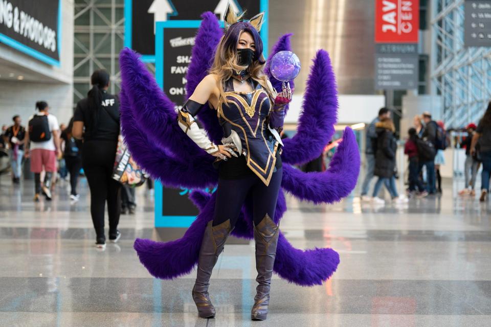 A cosplayer dressed as League of Legends character Ahri at New York Comic Con 2022.