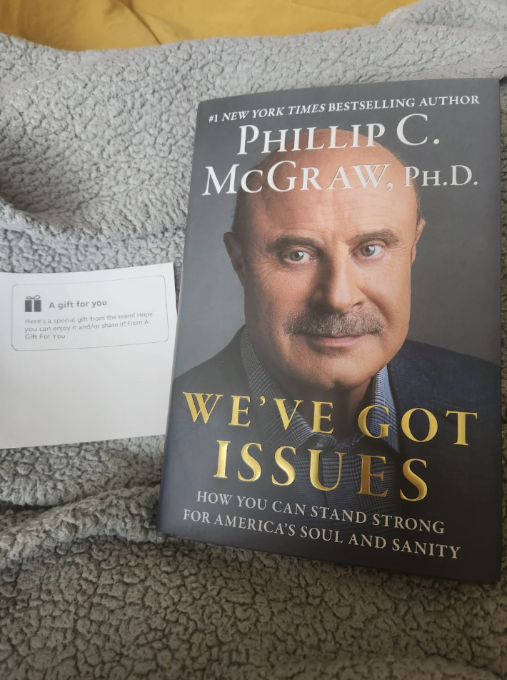 Book "Life Code" by Phillip C. McGraw, with a note saying "A gift for you"