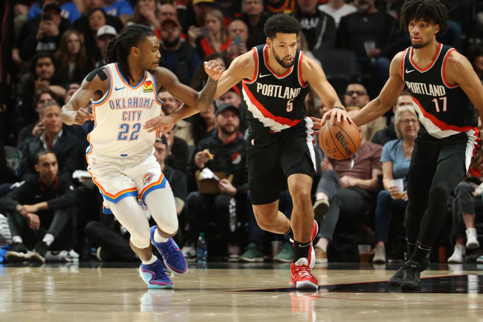 Nov 19, 2023; Portland, Oregon, USA; Portland Trail Blazers guard <a class="link " href="https://sports.yahoo.com/nba/players/6442" data-i13n="sec:content-canvas;subsec:anchor_text;elm:context_link" data-ylk="slk:Skylar Mays;sec:content-canvas;subsec:anchor_text;elm:context_link;itc:0">Skylar Mays</a> (5) dribbles up the court past Oklahoma City Thunder guard <a class="link " href="https://sports.yahoo.com/nba/players/10107" data-i13n="sec:content-canvas;subsec:anchor_text;elm:context_link" data-ylk="slk:Cason Wallace;sec:content-canvas;subsec:anchor_text;elm:context_link;itc:0">Cason Wallace</a> (22) in the first half at Moda Center. Mandatory Credit: Jaime Valdez-USA TODAY Sports