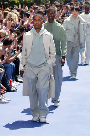 Kid Cudi presents a creation by designer Virgil Abloh as part of his Spring/Summer 2019 collection for Louis Vuitton fashion house during Men's Fashion Week in Paris, France, June 21, 2018. REUTERS/Charles Platiau