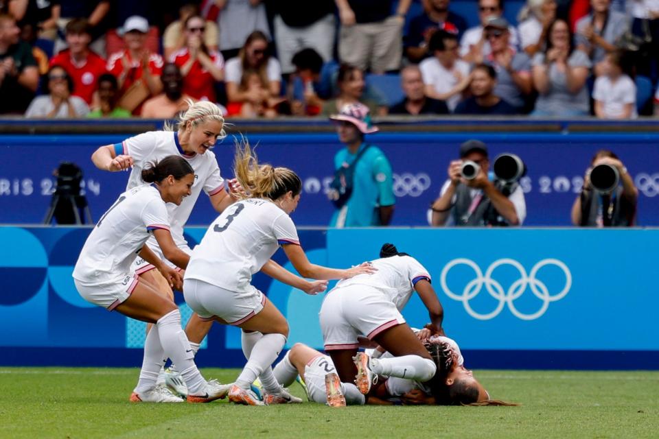 United States forward Trinity Rodman is mobbed after her goal against Japan in the quarterfinals of the Paris Olympics at Parc des Princes in Paris on Aug. 3, 2024.