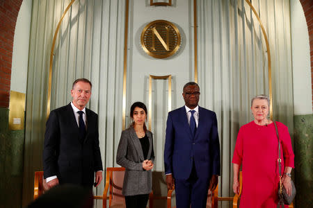 Leader of the Norwegian Nobel Committee, Berit Reiss-Anderseninn, the Nobel Peace Prize laureates Nadia Murad and Denis Mukwege, and secretary of the Nobel Committee Olav Njolstad attend a news conference at the Nobel Institute in Oslo, Norway December 9, 2018. NTB Scanpix/Heiko Junge via REUTERS