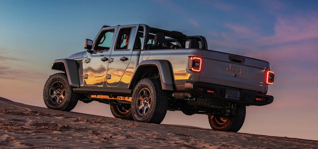 2023 Jeep Gladiator, sunset is being reflected along the driver's side of the vehicle