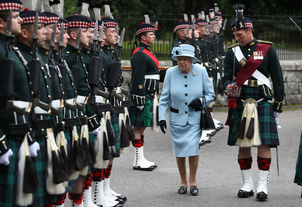 Queen Elizabeth II inspects the Balaklava Company, 5 Battalion The Royal Regiment of Scotland at the gates at Balmoral, as she takes up summer residence at the castle. (Photo by Andrew Milligan/PA Images via Getty Images)