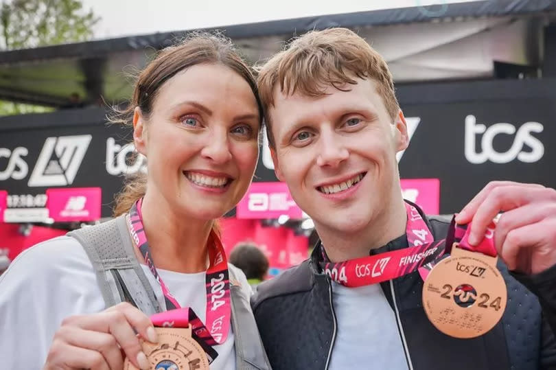 Actors Jamie and Emma ran the marathon which was being filmed for the BBC soap