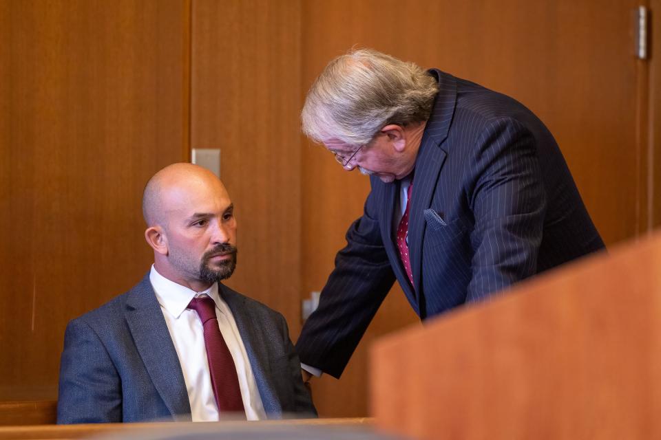 Attorney Larry Whitney talks to his client, Fred Klemp, before a hearing Wednesday in which Klemp pleaded no contest and was convicted of aggravated vehicular homicide for a 2021 crash on a frozen reservoir in Coventry Township.