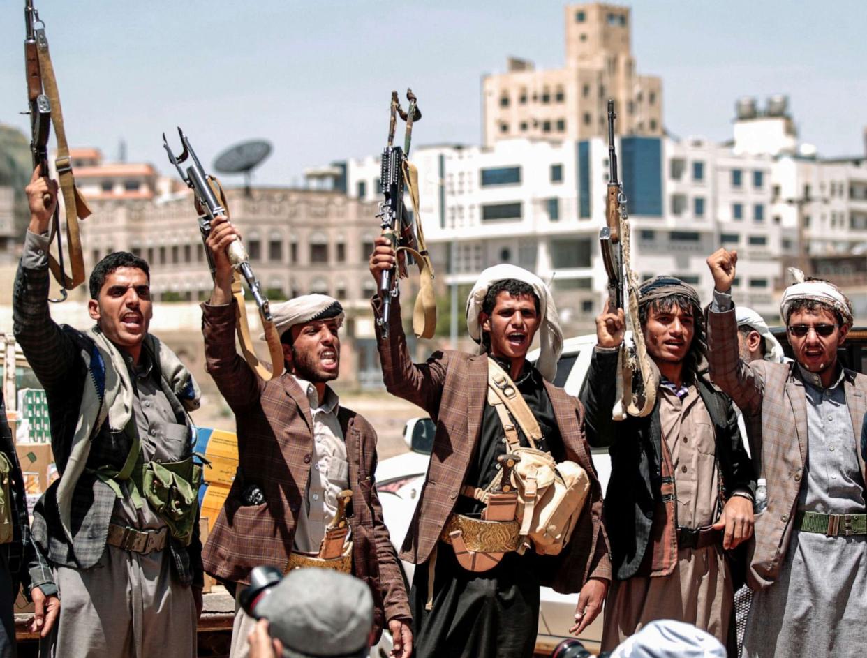 PHOTO: Men chant slogans as they hold up Kalashikov assault rifles during a tribal meeting in the Houthi rebel-held capital Sanaa, Yemen, Sept. 21, 2019. (Mohammed Huwais/AFP via Getty Images)