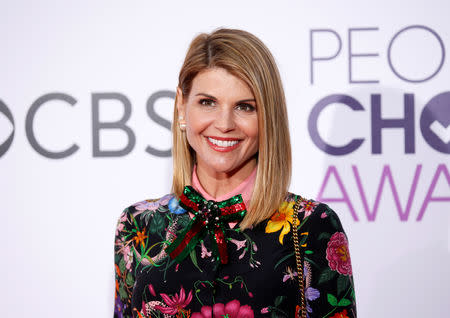 FILE PHOTO: Actress Lori Loughlin arrives at the People's Choice Awards 2017 in Los Angeles, California, U.S., January 18, 2017. REUTERS/Danny Moloshok/File Photo