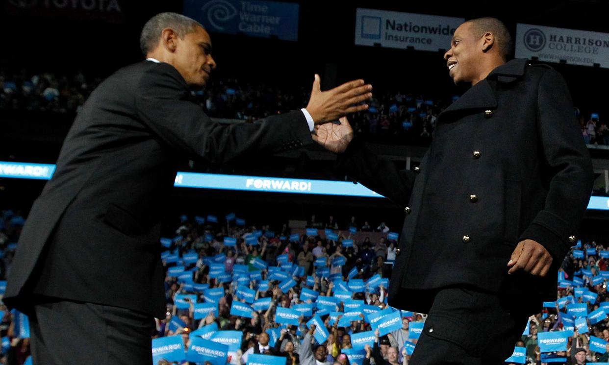 <span>Barack Obama is greeted on stage by Jay-Z in 2012.</span><span>Photograph: Jason Reed/Reuters</span>